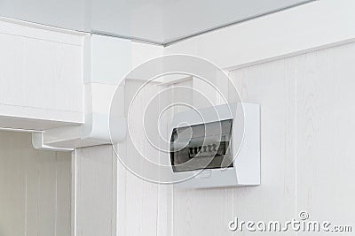 White plastic electric guard on a white wall Stock Photo