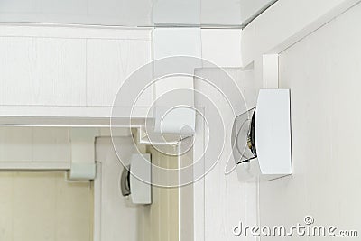 White plastic electric guard on a white wall Stock Photo