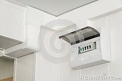 White plastic electric guard on a white wall Stock Photo