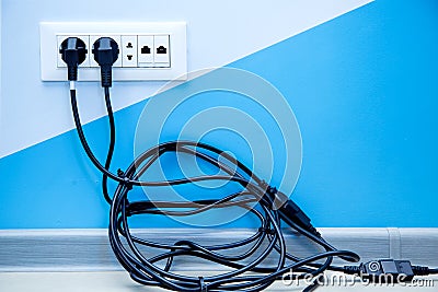 Multiple outlet with a pile of black cable. Stock Photo