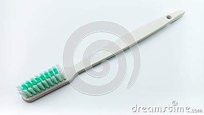 White Plastic Toothbrush Isolated On White Background. Tilted View From Above Stock Photo