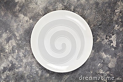 A white plate. An object. Clean. for food. View from above. For your design. Texture. Stock Photo