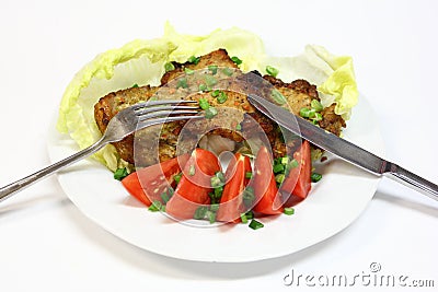 Grilled pork chops with tomatoes and lettuce Stock Photo