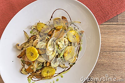 White plate with sauteed vegetables Stock Photo