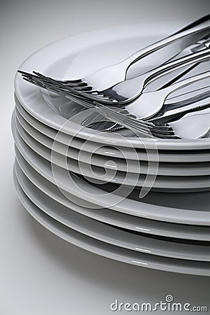 White Plates and Silverware Stock Photo