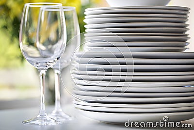 White plates and wine glasses Stock Photo