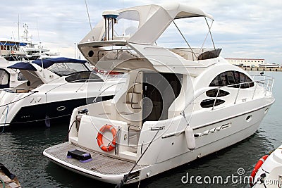 White pleasure yacht with a canvas awning Stock Photo
