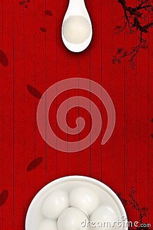 A white porcelain bowl of rice balls is placed on a traditional auspicious cloud, plum, and wooden board texture background. Stock Photo