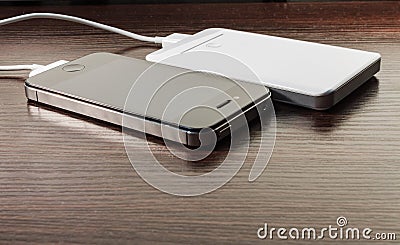 White portable power bank and mobile phone Stock Photo