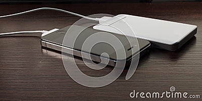 White portable power bank and mobile phone Stock Photo