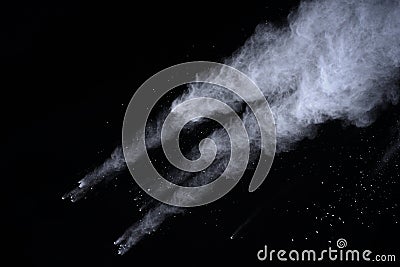 White powder explosion on black background. Colored cloud. Colorful dust explode. Paint Holi Stock Photo