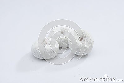 White Powdered Sugar Donuts on a White Background Stock Photo