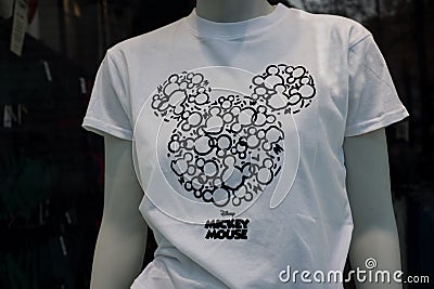 White printed tee-shirt with Mickey mouse symbols in a fashion store showroom Editorial Stock Photo