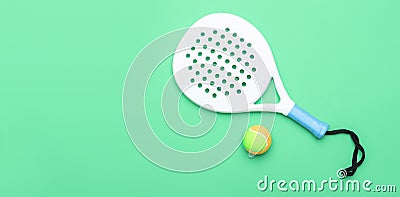 White professional paddle tennis racket and ball on mint color background. Horizontal sport theme poster, greeting cards, headers, Stock Photo