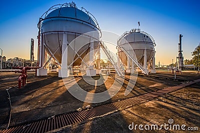 White propane tank with a fuel gas pipeline in the morning Stock Photo