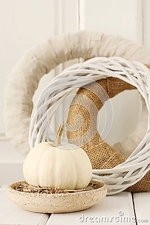 White pumpkin baby boo and natural wreaths on the table Stock Photo