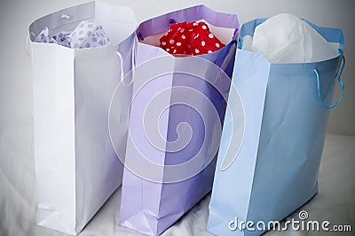 White, purple and blue paper gift shopping bags Stock Photo