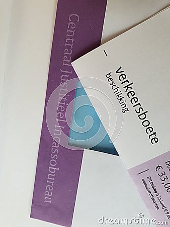 White purple envelope and traffic fine in the Netherlands send by the central justice debt collection Editorial Stock Photo