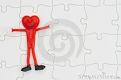 White puzzle with a happy smiling heart with space for your concept words Stock Photo