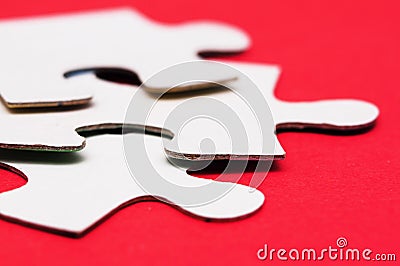 White puzzle on red Stock Photo