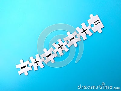 White puzzle with the symbol subtract, add and equal Stock Photo