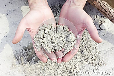 White Quartz Sand In The Hands Stock Photo