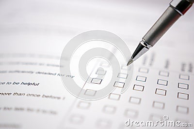 White questionare with pen to select the choice Stock Photo