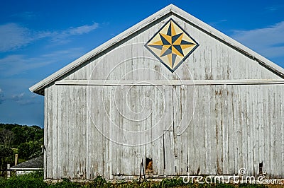 White Quilt Barn with Geometric Star Pattern Stock Photo