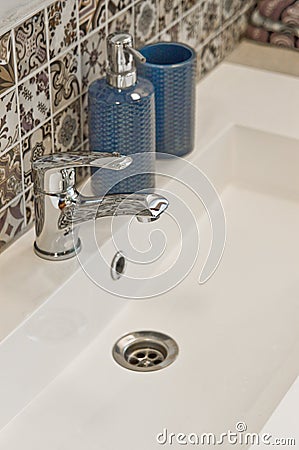 White rectangular sink detail with chrome tap Stock Photo
