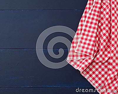 White red checkered kitchen towel on a blue wooden background Stock Photo