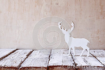 White reindeer on wooden table .selective focus Stock Photo