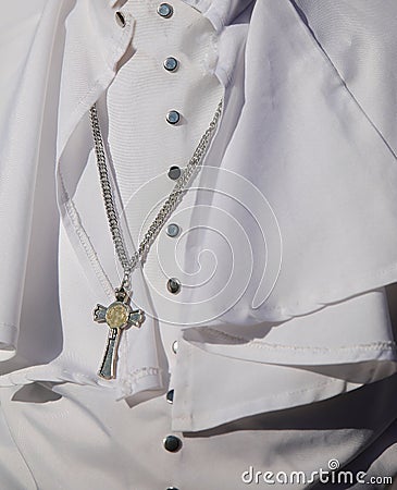 White religious cassock worn by the pontiff during ceremonies with the crucifix Stock Photo