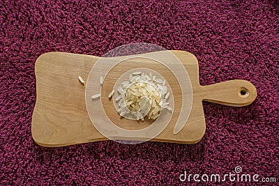 White rice on a wooden board Stock Photo