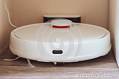 White robot vacuum cleaner. robotic exhauster Stock Photo