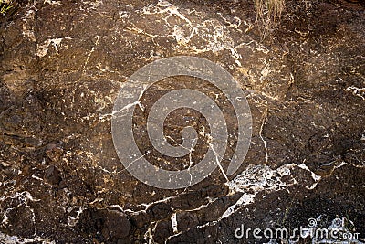 White Rock Embedded In Black Rock Look Like Paint Splatter Stock Photo