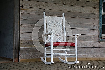 White rocking chair in abandoned cabin in Alabama. Stock Photo
