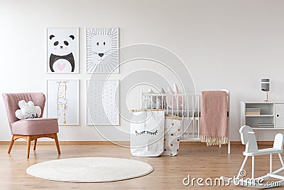 Pink armchair in child`s room Stock Photo
