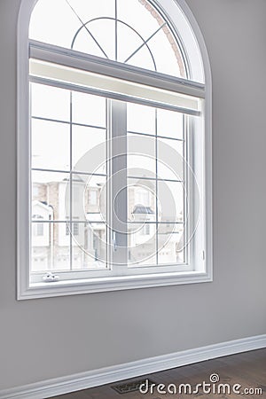 White room wall in house with large arch shape window Stock Photo