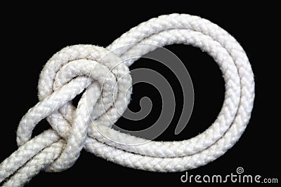 A white rope tied with bowline on a bight knot on black background Stock Photo