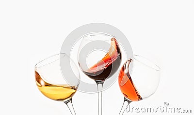 White, rose, red wine splashes, diagonal waves in glasses. Stock Photo