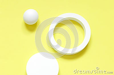 White round geometrical shapes on the brigth yellow background. Stock Photo