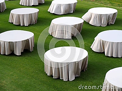 White Round table on green filed Stock Photo