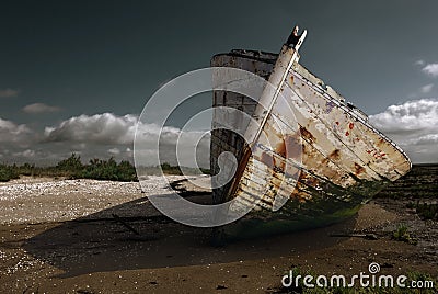 White rusty prow on the beach Stock Photo