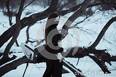 White samurai ninja cute girl outdoors in winter Stock Photo