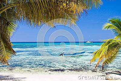 White sand beach boat blue ocean Stock Photo