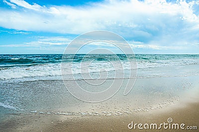 White sand and blue sea with waves Stock Photo