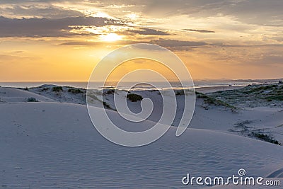 White sand dunes of Birubi beach at sunset. Stock Photo