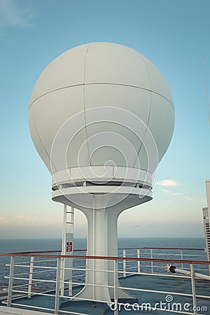 White Satellite and Communication Equipment Against Sky on Cruise Ship Stock Photo