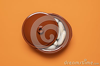 White sausage cooked in a ceramic pot. German veal sausage. Bavarian cuisine Stock Photo