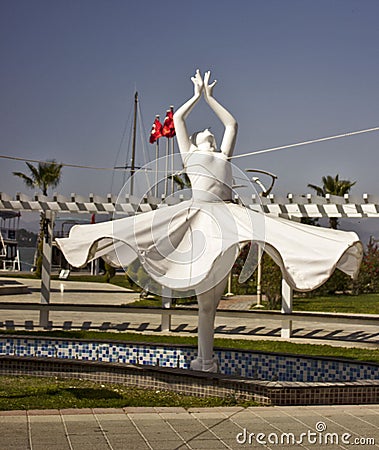 A white statue of a lady ballet dancer with a blue sky background Editorial Stock Photo